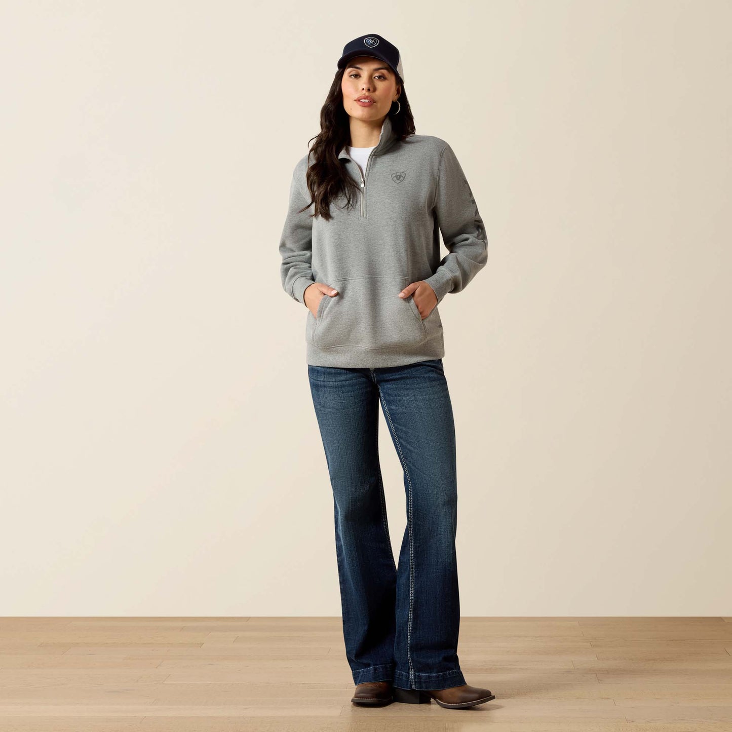 Woman in grey sweatshirt and jeans
