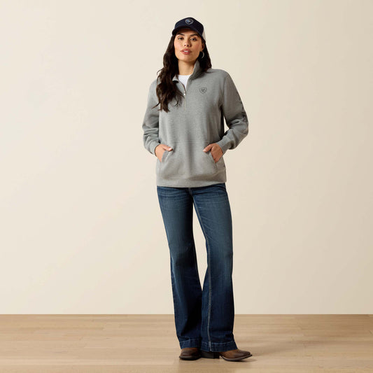 Woman in grey sweatshirt and jeans