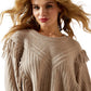 Woman wearing fringe sweater
