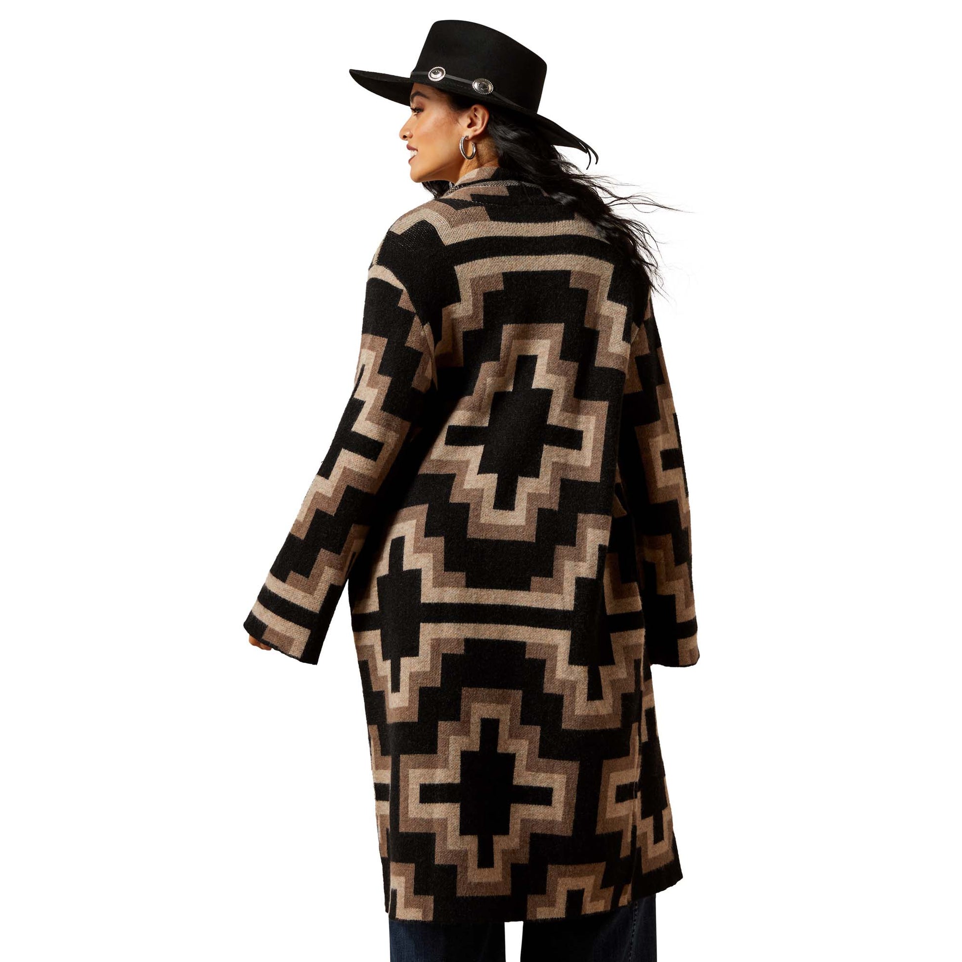 Woman in black & tan patterned coat, back view.