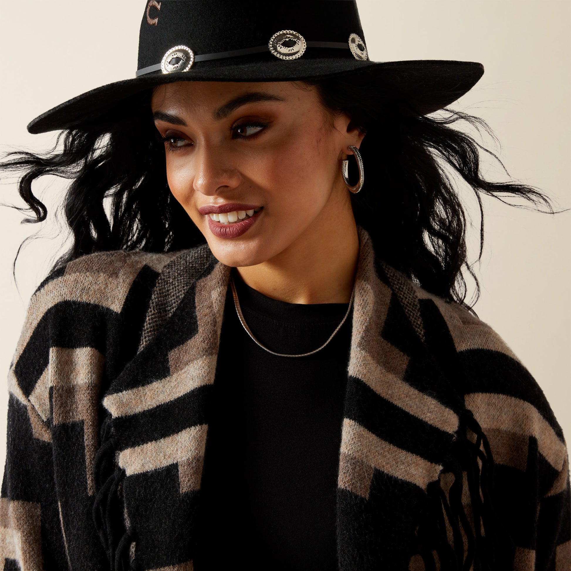 Woman wearing a warm patterned jacket and hat