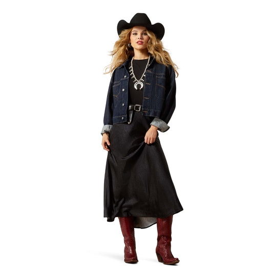 Woman in denim jacket, skirt, and boots (F25_WMS_WEST_10065952_full)