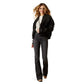Woman in black jacket and jeans - F25_WMS_WEST_10065955
