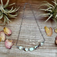 Necklace with light green stones and dried flowers