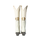 Pair of white cowboy boots with gold accents.
