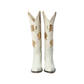 Pair of cream cowboy boots with gold rose details.