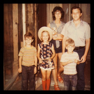Family of five posing for a photo.