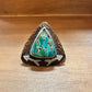 Turquoise stone ring with arrow accents.