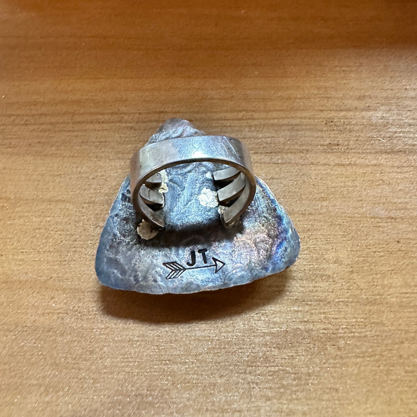 Silver ring with a blue stone.