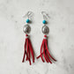 Red tassel earrings with turquoise beads.