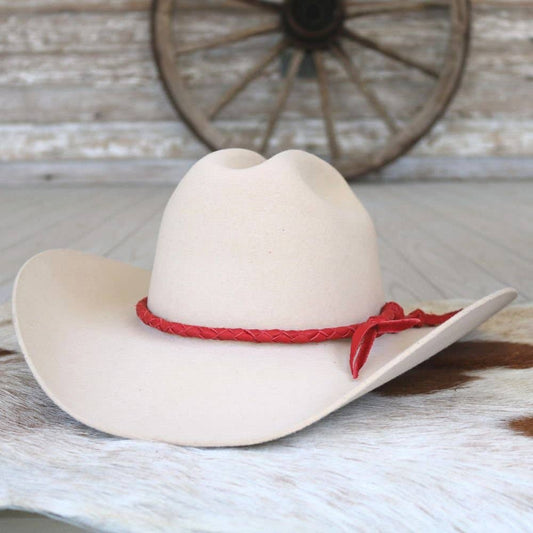 White cowboy hat with red band.