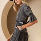Woman in denim dress and hat