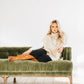 Cossette Saddle Boots & Sweater on Green Couch