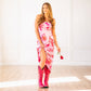 Woman in hot pink Cossette boots and floral dress