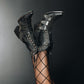 Black Showdown Rattleblack LS6 Boots on legs with fishnet stockings