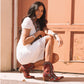Woman wearing Showdown Bootie in Smoldering Ruby