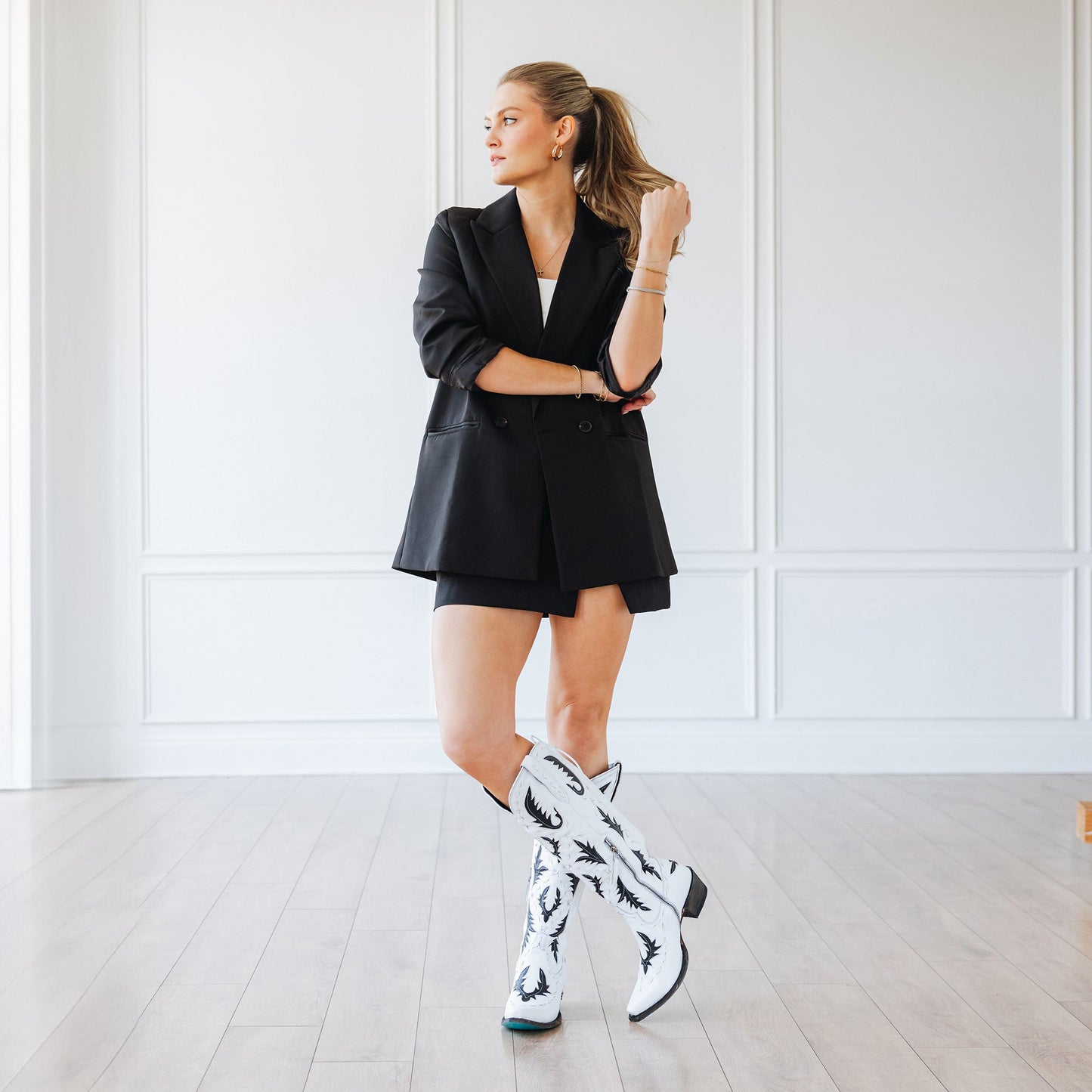 Woman in blazer and cowboy boots, Reverie newsprint style