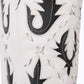 White & black cutout boot, Reverie newsprint design
