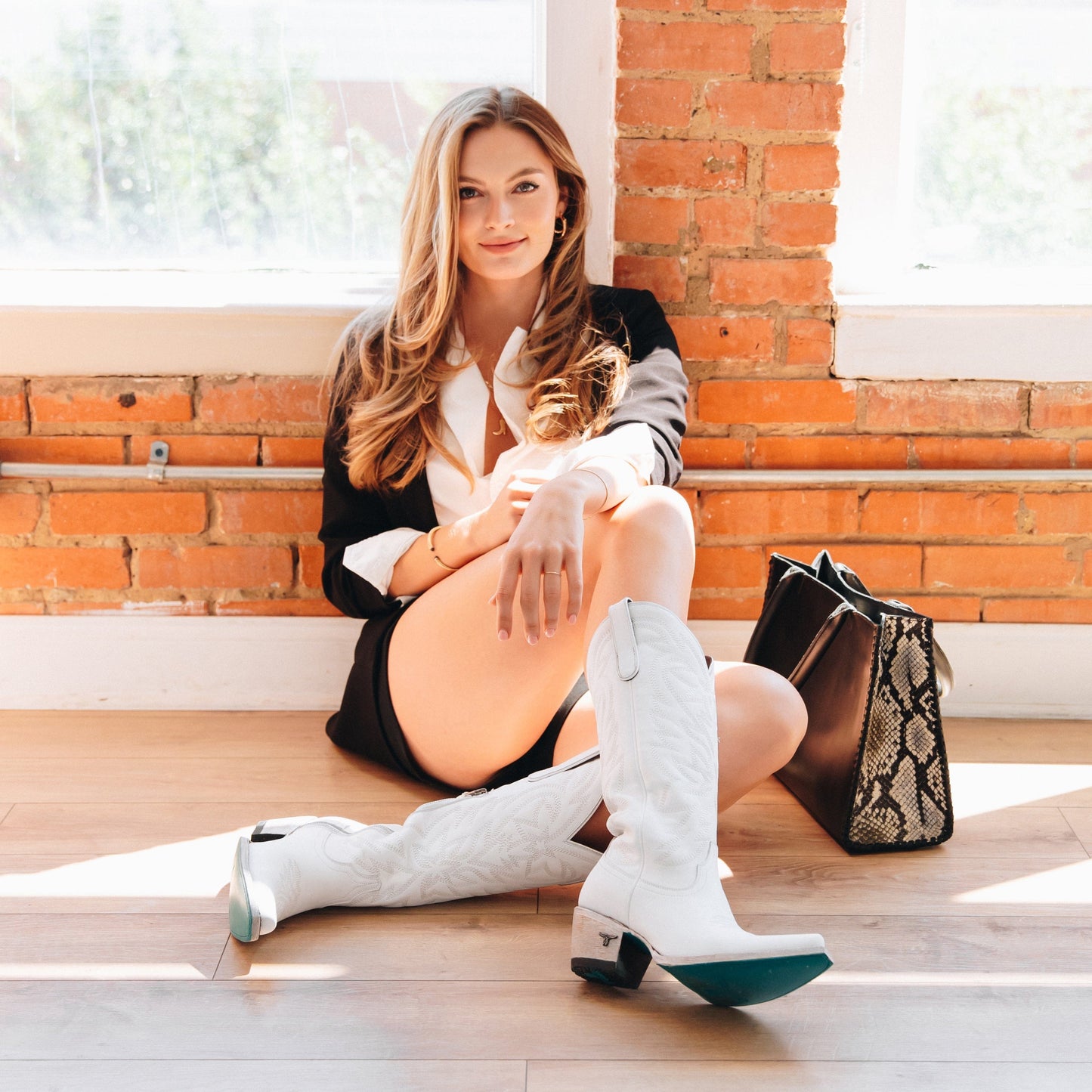 Blonde woman in white boots, Smokeshow photo by Matthew White.