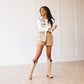 Woman in Squash Blossom outfit, shorts & boots