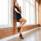 Becca in black dress & wedge sandals