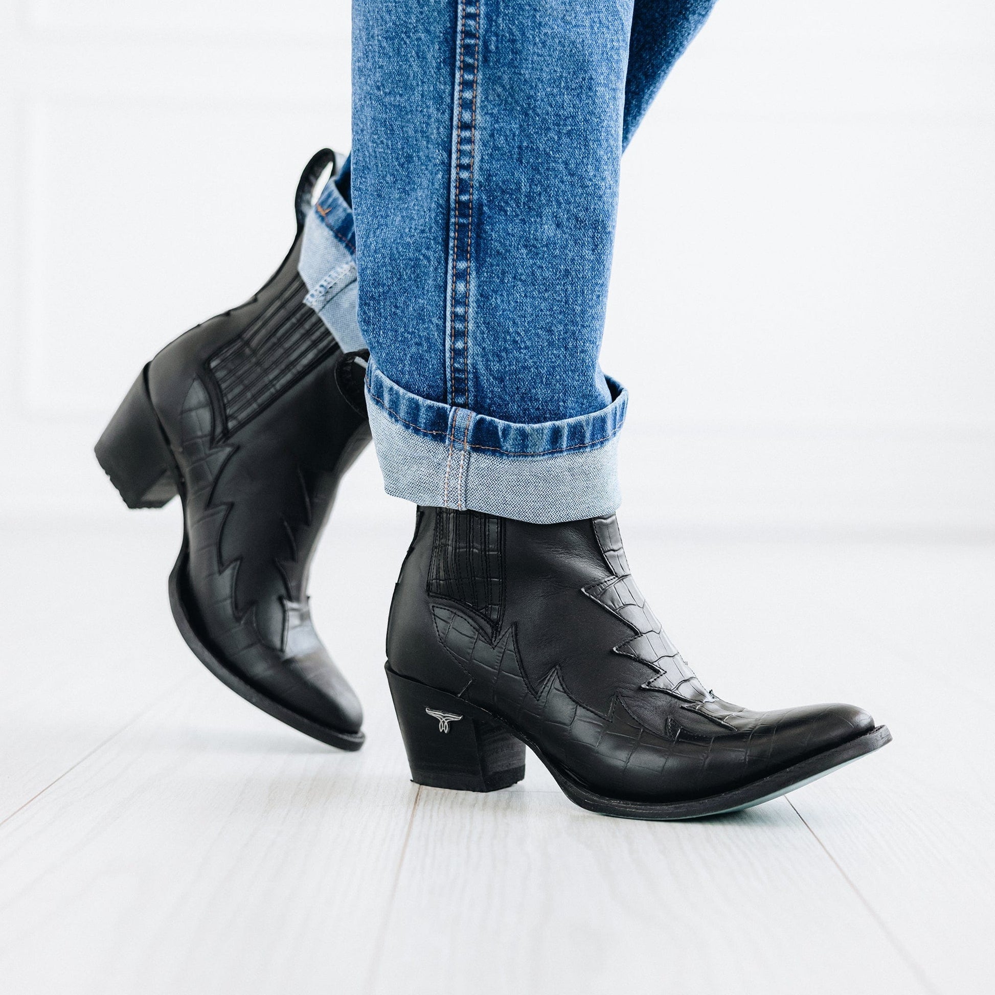 Black western Chelsea boots with jeans