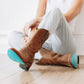 Burnt caramel Plain Jane Midi boots with turquoise soles