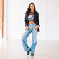 Woman wearing Plain Jane Mule matte black boots