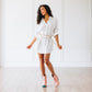 Woman in white dress and blush booties