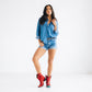 Woman in jean shorts and red Emma Jane booties