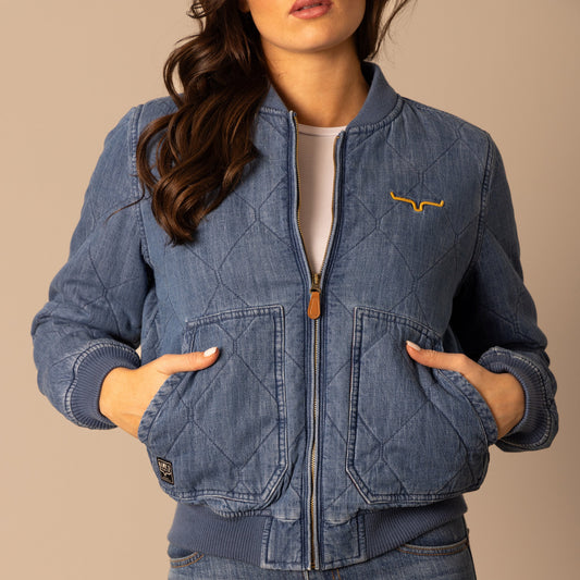 Woman wearing denim quilted jacket