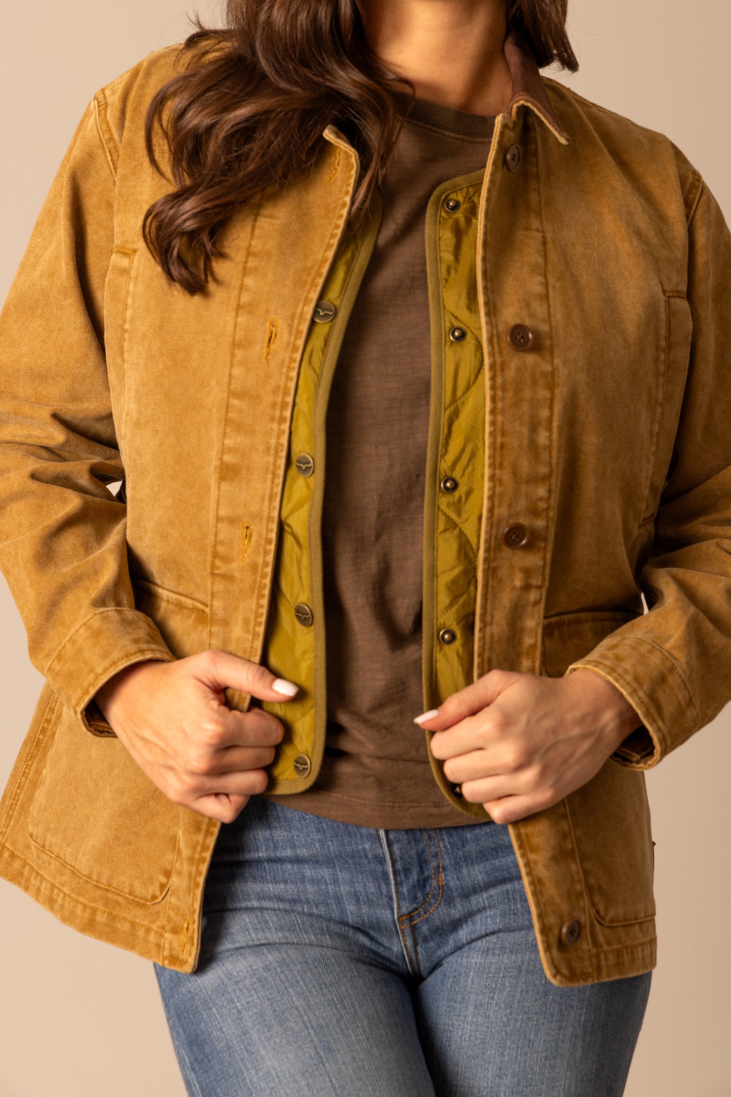Woman in tan corduroy jacket