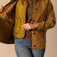 Woman in brown jacket and quilted vest - unnamed-172