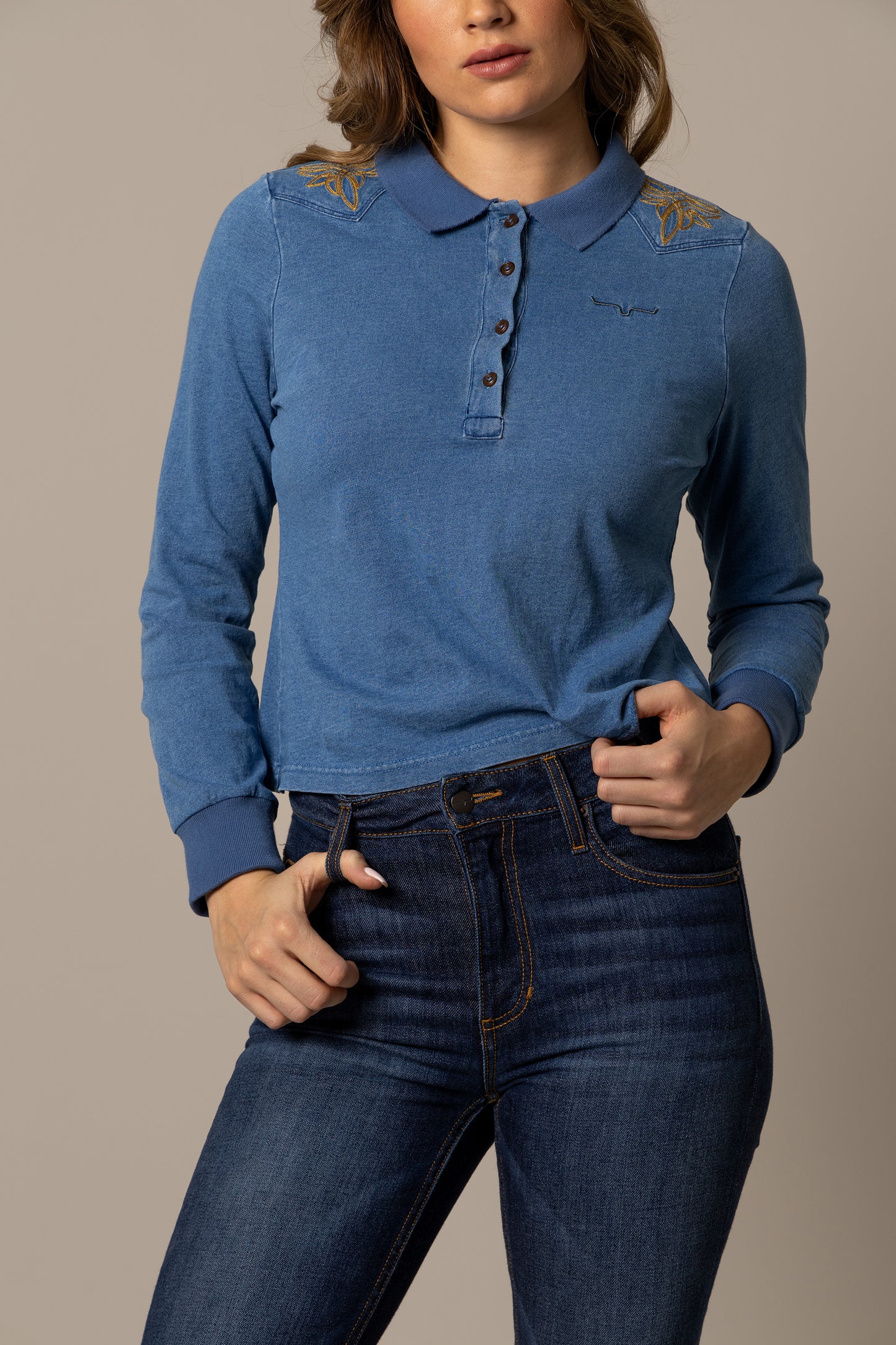 Woman wearing blue long-sleeve polo shirt and jeans (unnamed-197)