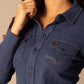 Woman wearing blue button-down shirt