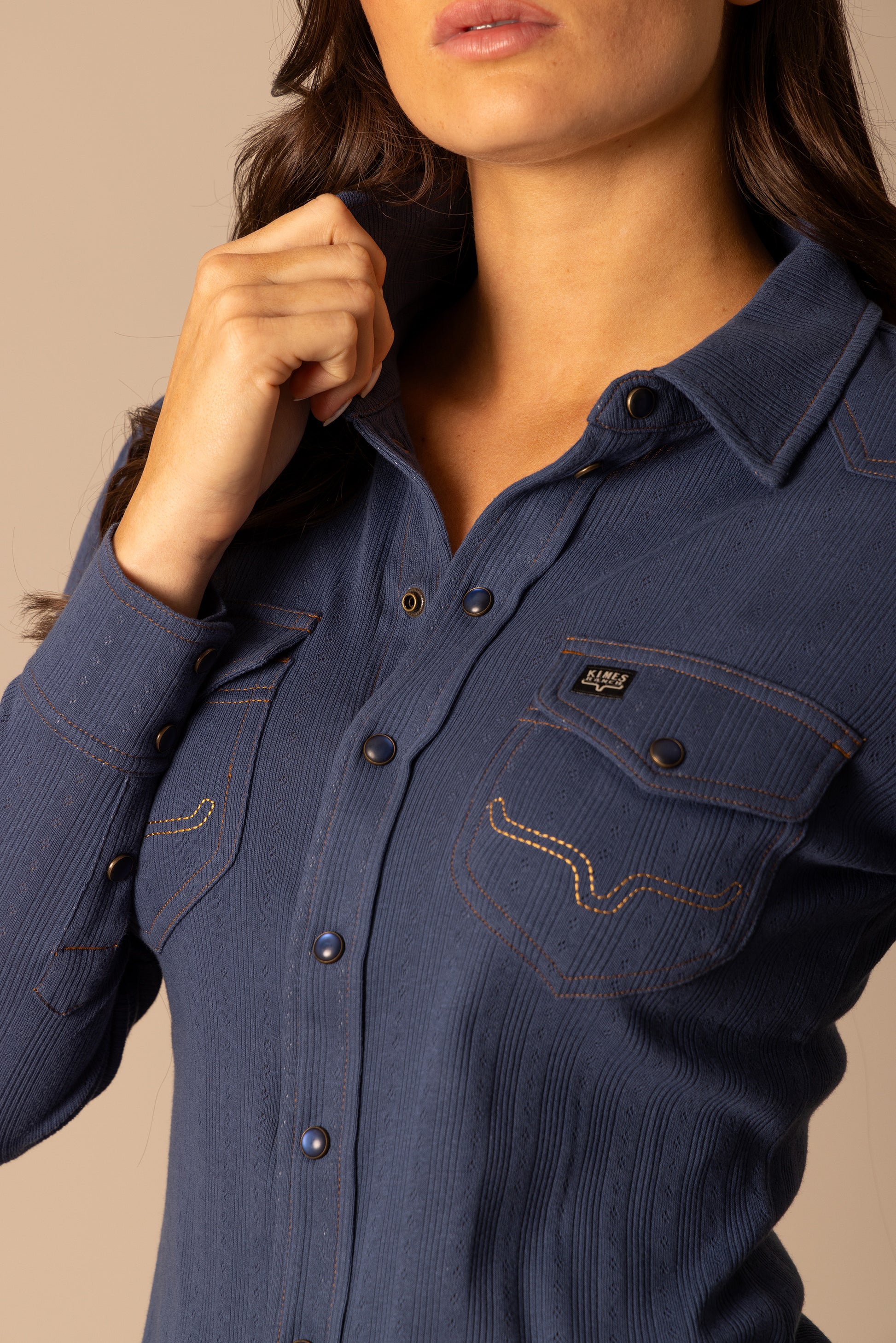 Woman wearing blue button-down shirt